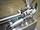 Used Wenzhou Rigao Table Top Semi Automatic Piston Filler, Model DYF. 316L Stainless steel product contact. Filling speed 5 to 20 bottles per minute. Filling accuracy /= 1% +/-. Filling range: approx...